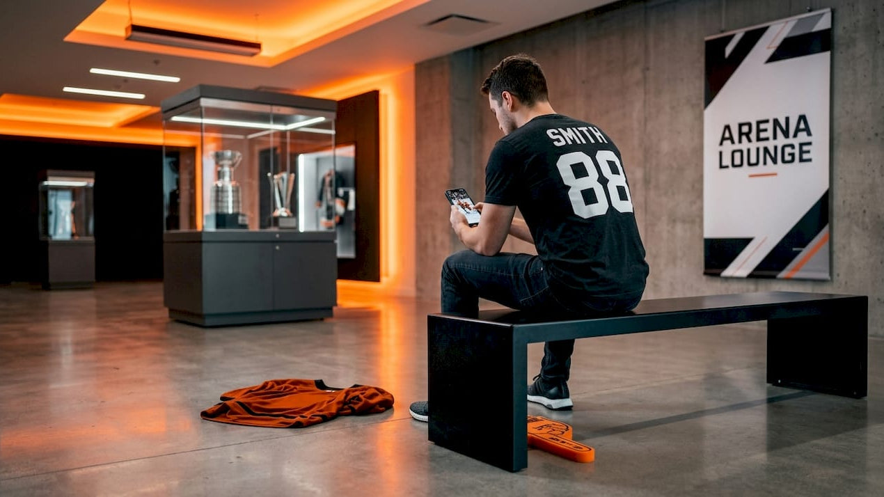 Hockey fan wearing personalized shirt sitting on bench