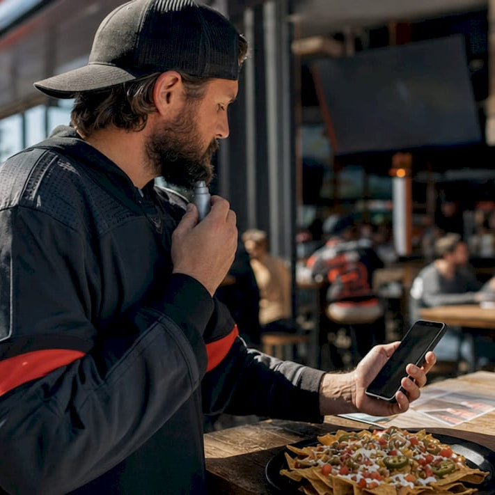 Hockey fan engaging with merchandise and fan rituals