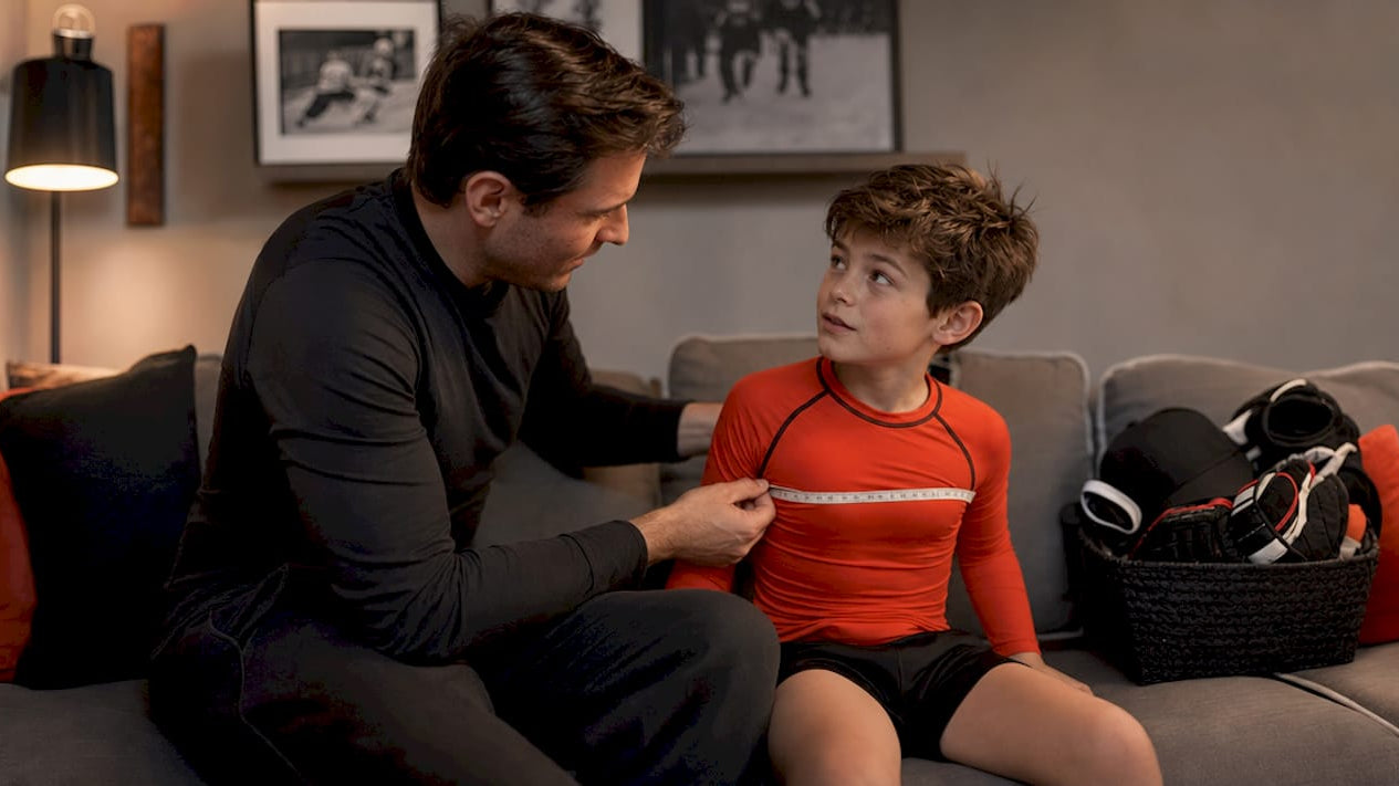 Parent measuring child's hockey shirt size