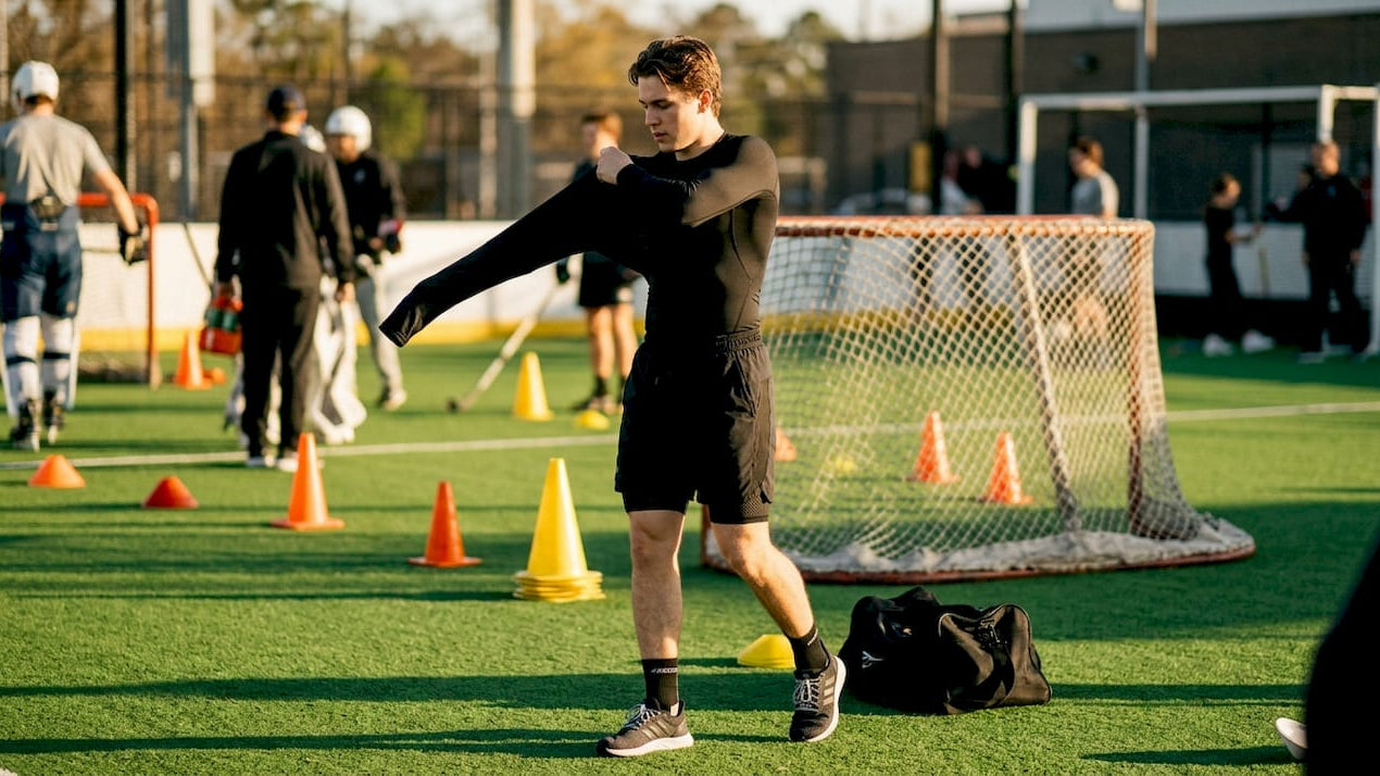 Hockey player wearing black compression base layer indoors