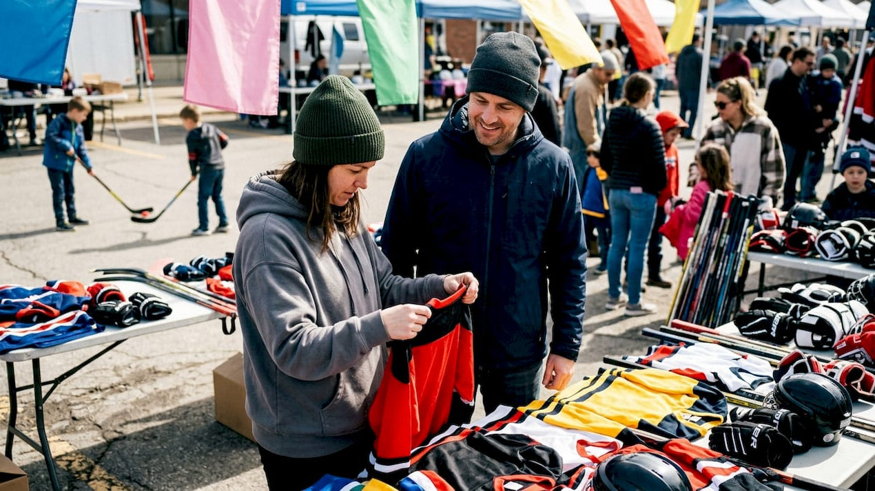 Parents selecting hockey clothing for child