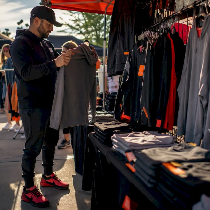 Team manager examining youth hockey hoodie sample