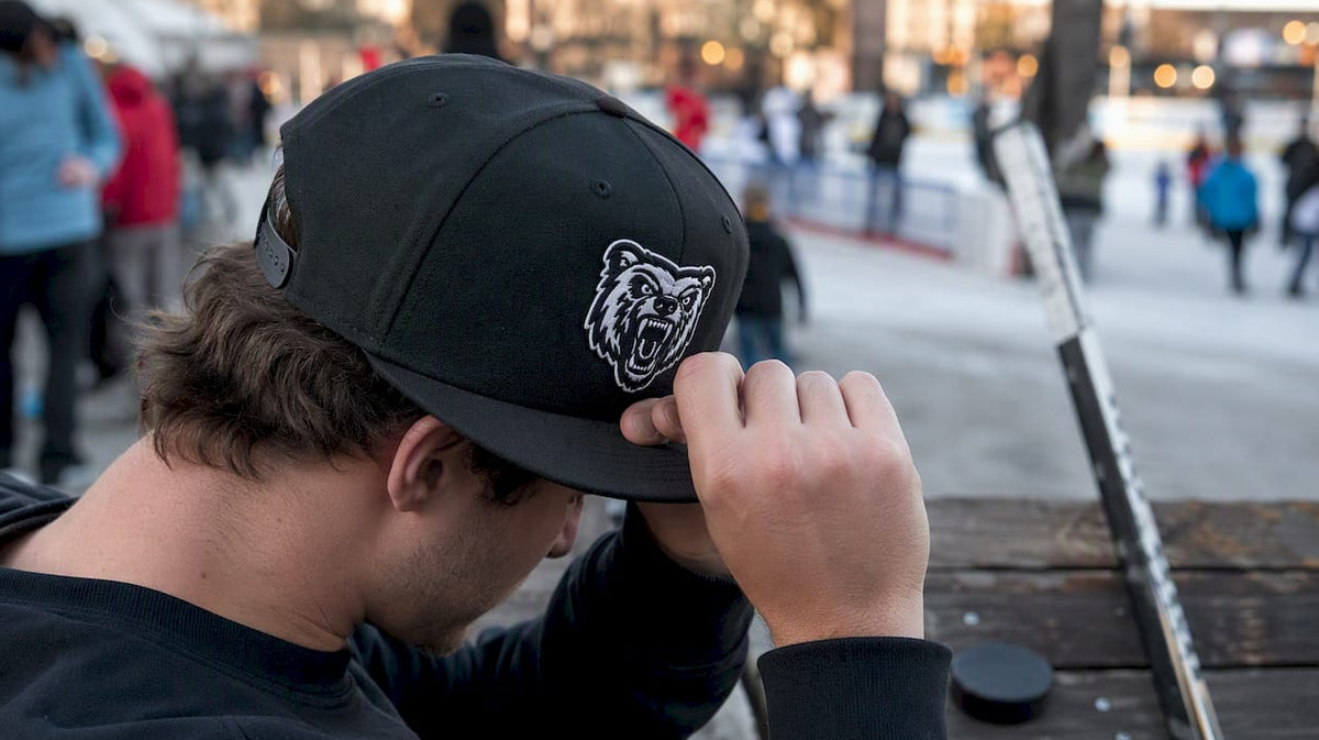 Player adjusting custom hockey snapback hat
