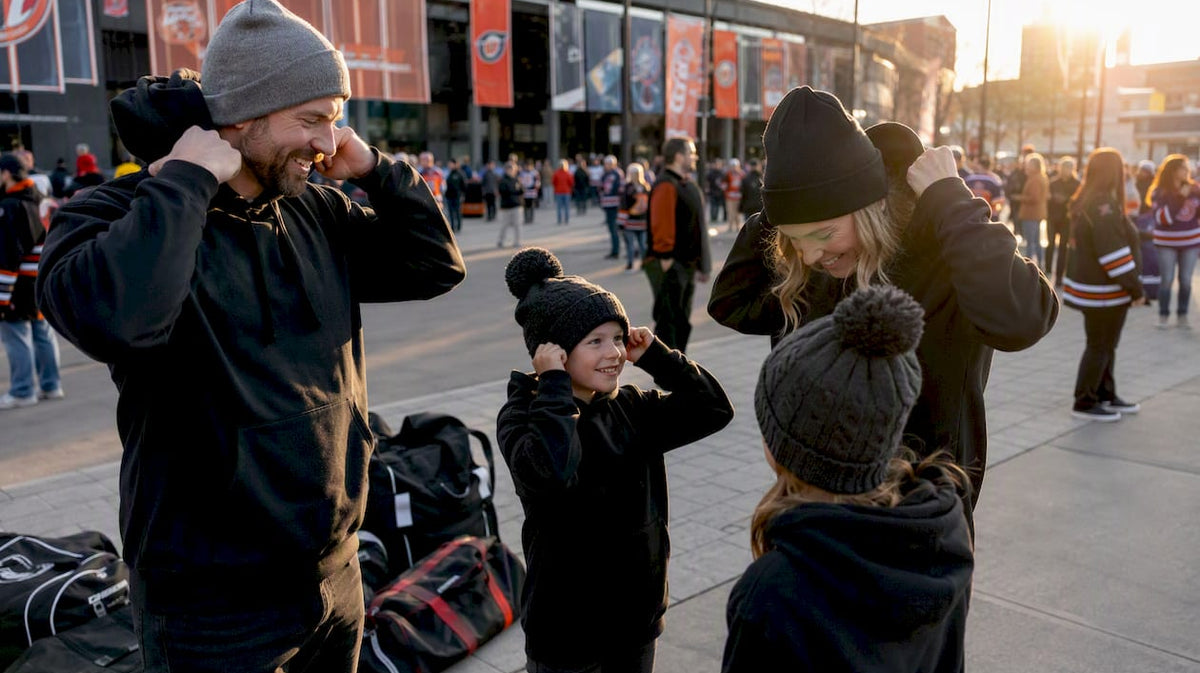 Hockey family putting on matching hoodies before game