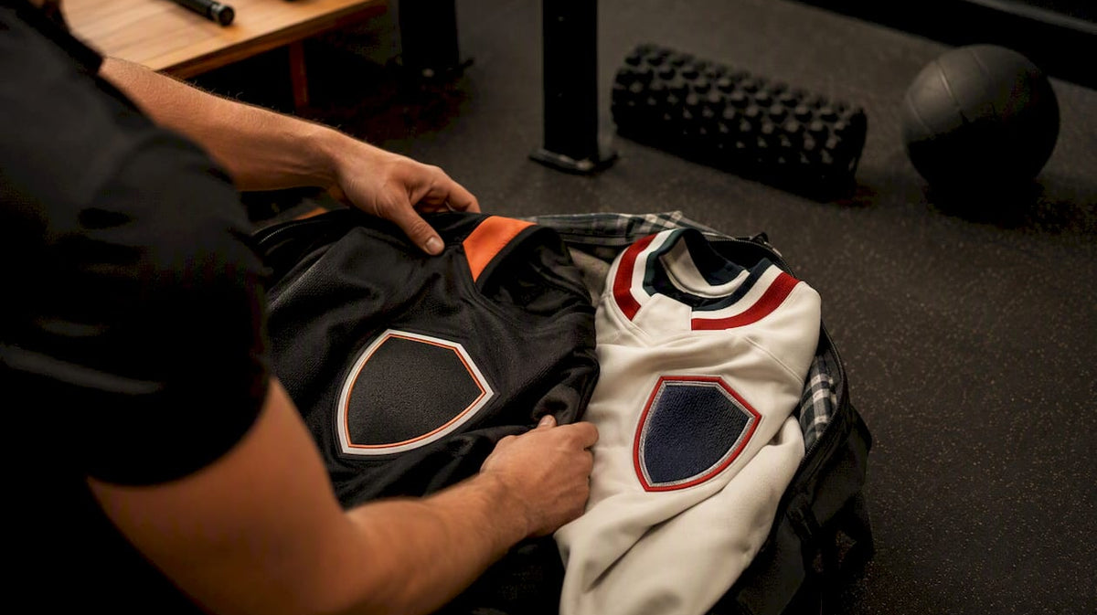 Hands sorting hockey jerseys side by side