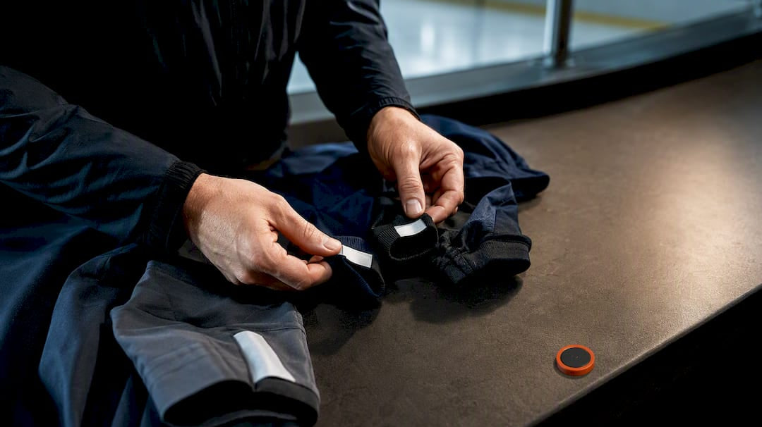 Coach reviewing apparel sizes for team extras