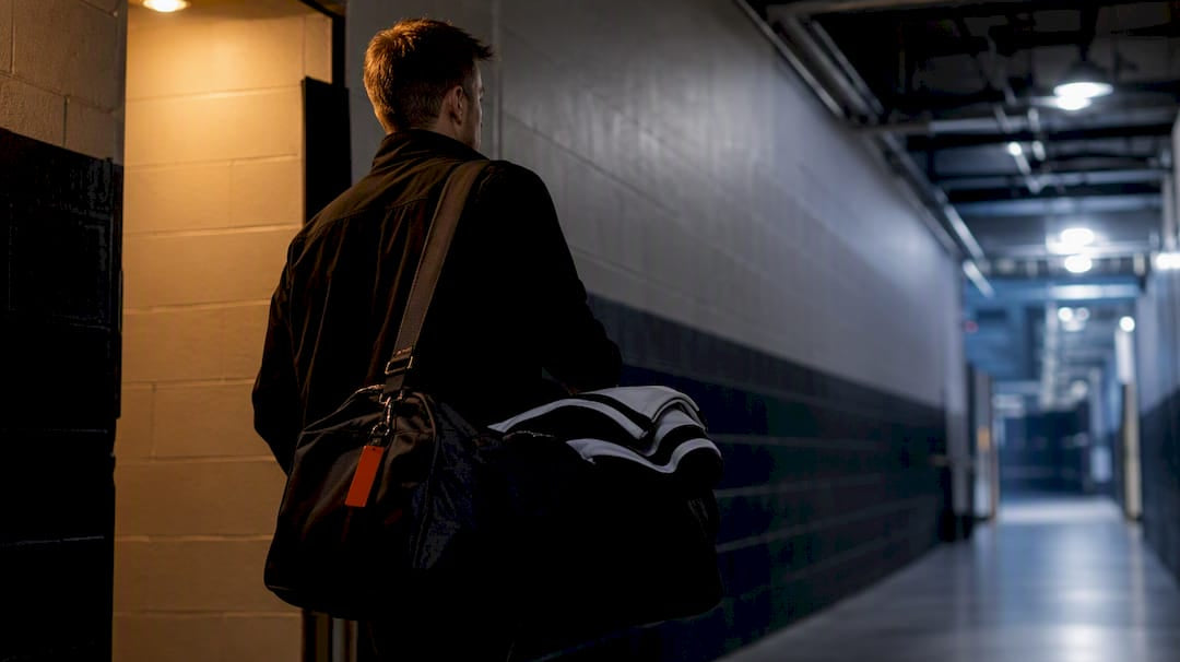 Manager carrying hockey tournament gear