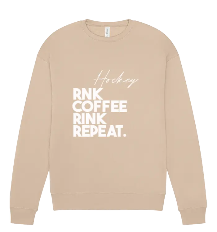 Unisex RNK Apparel Co. fleece crewneck sweatshirt with coffee-themed Rink Repeat graphic, cozy and stylish for casual wear.