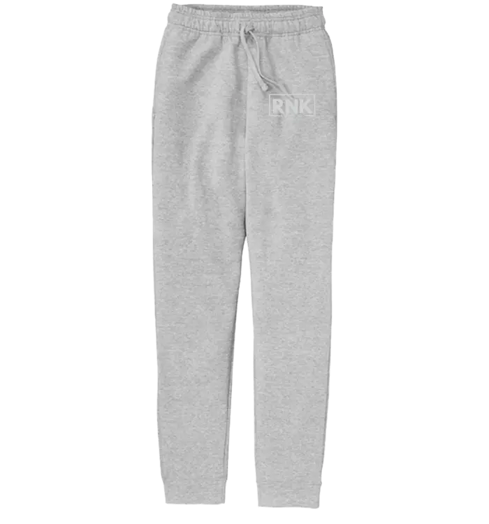 RNK Youth white logo fleece joggers with elastic waistband and cuffs, casual athletic pants for kids by RNK Apparel Co.