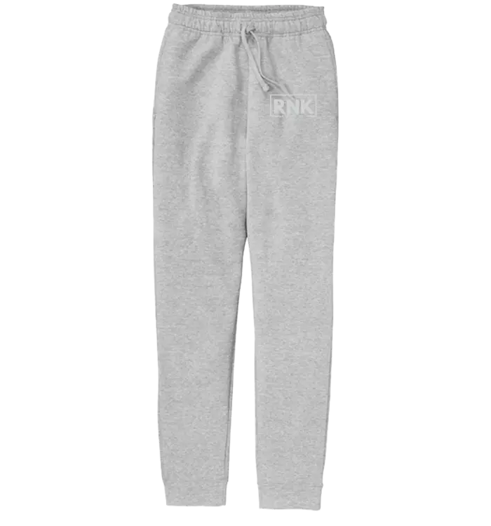 RNK Youth white logo fleece joggers with elastic waistband and cuffs, casual athletic pants for kids by RNK Apparel Co.