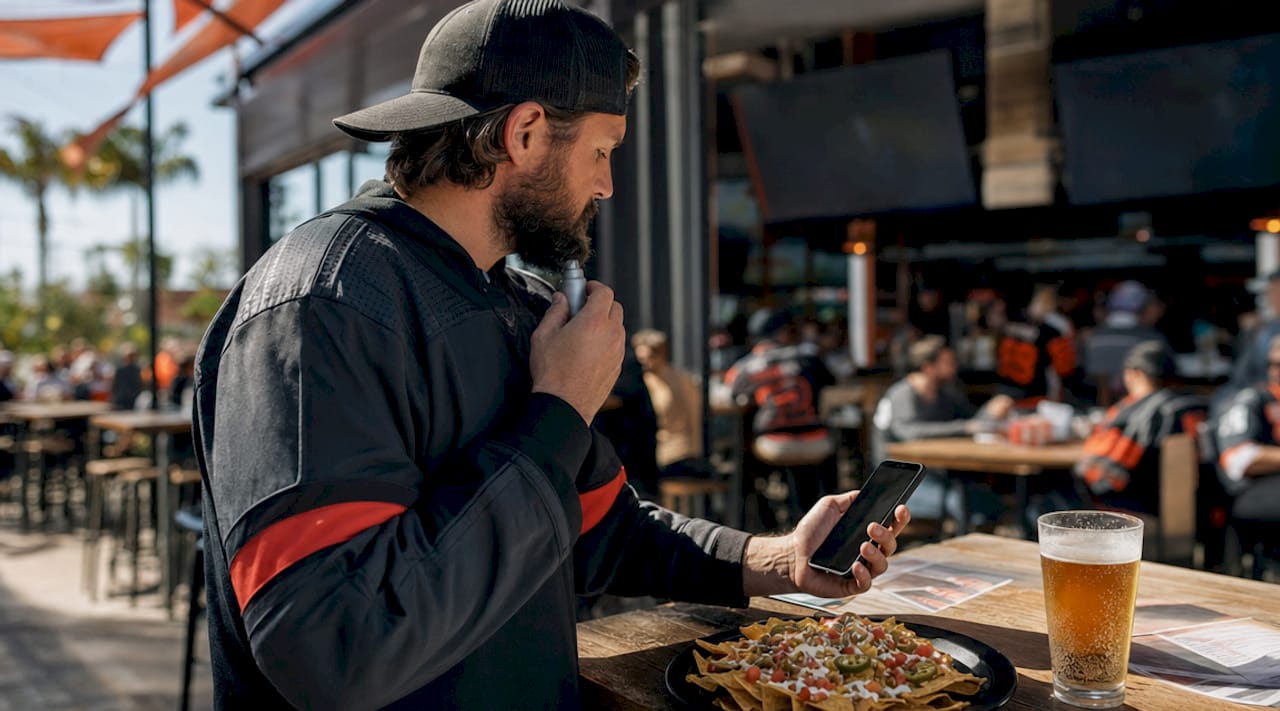 Hockey fan engaging with merchandise and fan rituals
