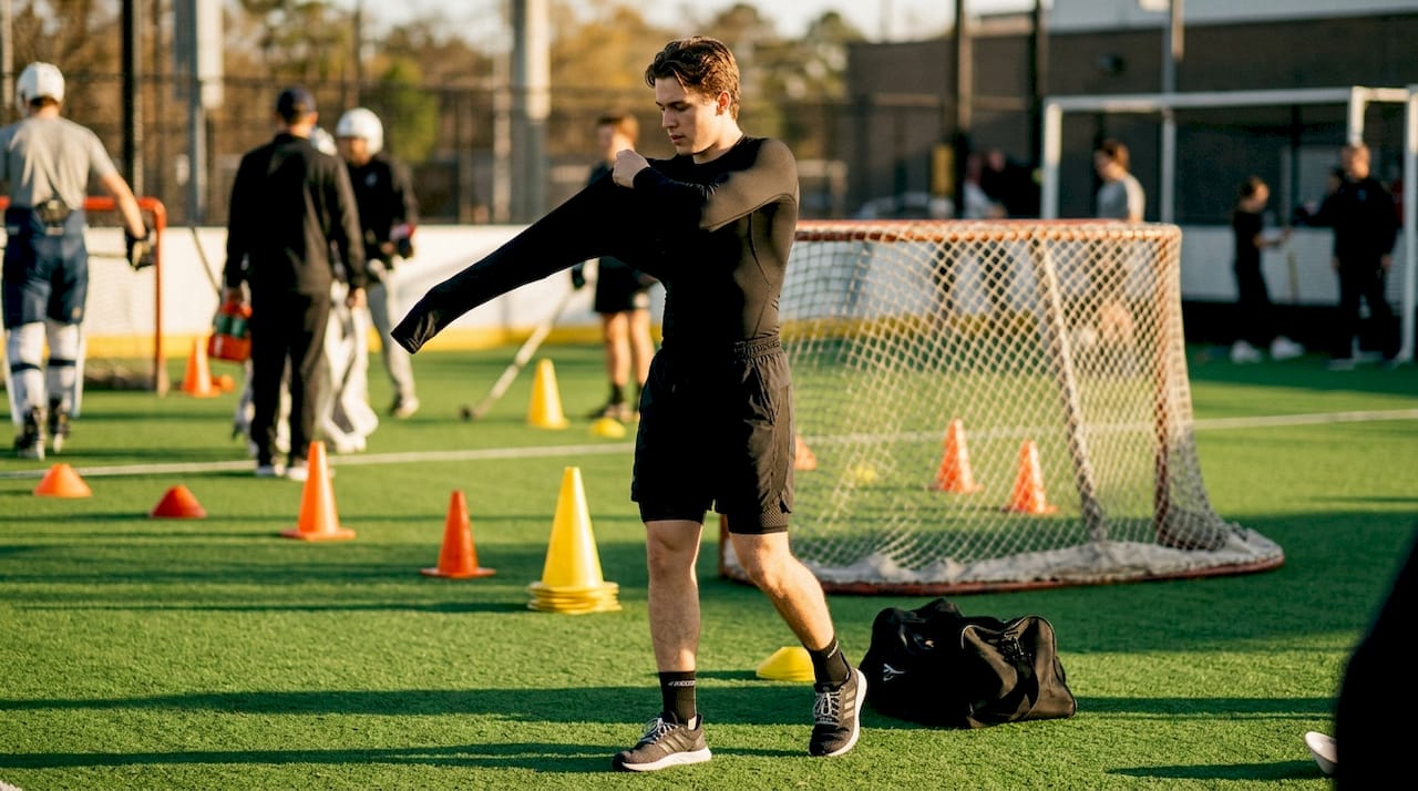 Hockey player wearing black compression base layer indoors