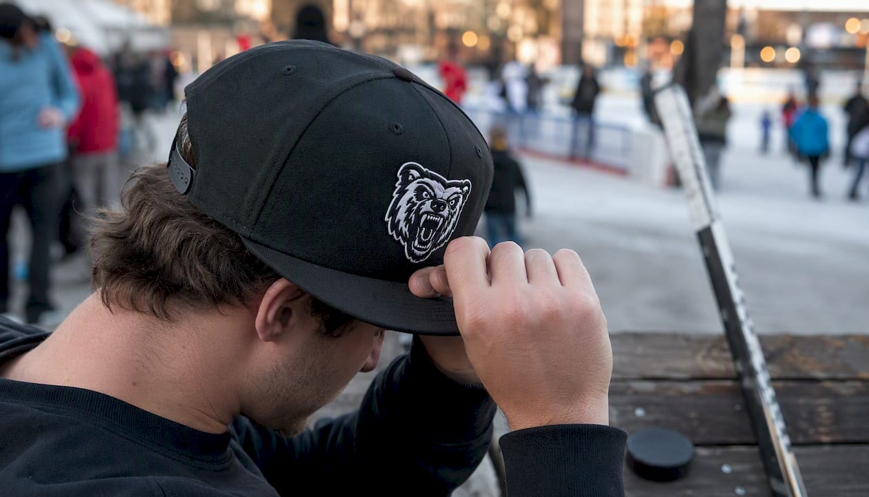 Player adjusting custom hockey snapback hat