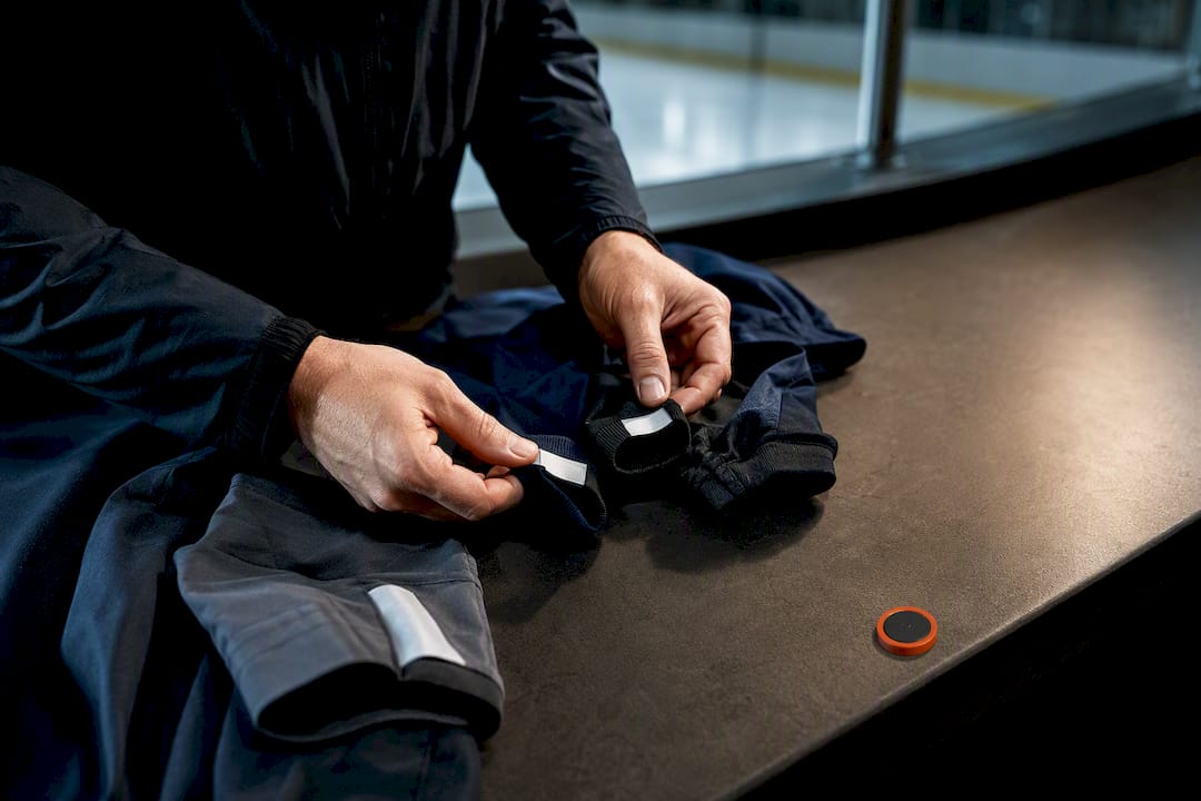 Coach reviewing apparel sizes for team extras