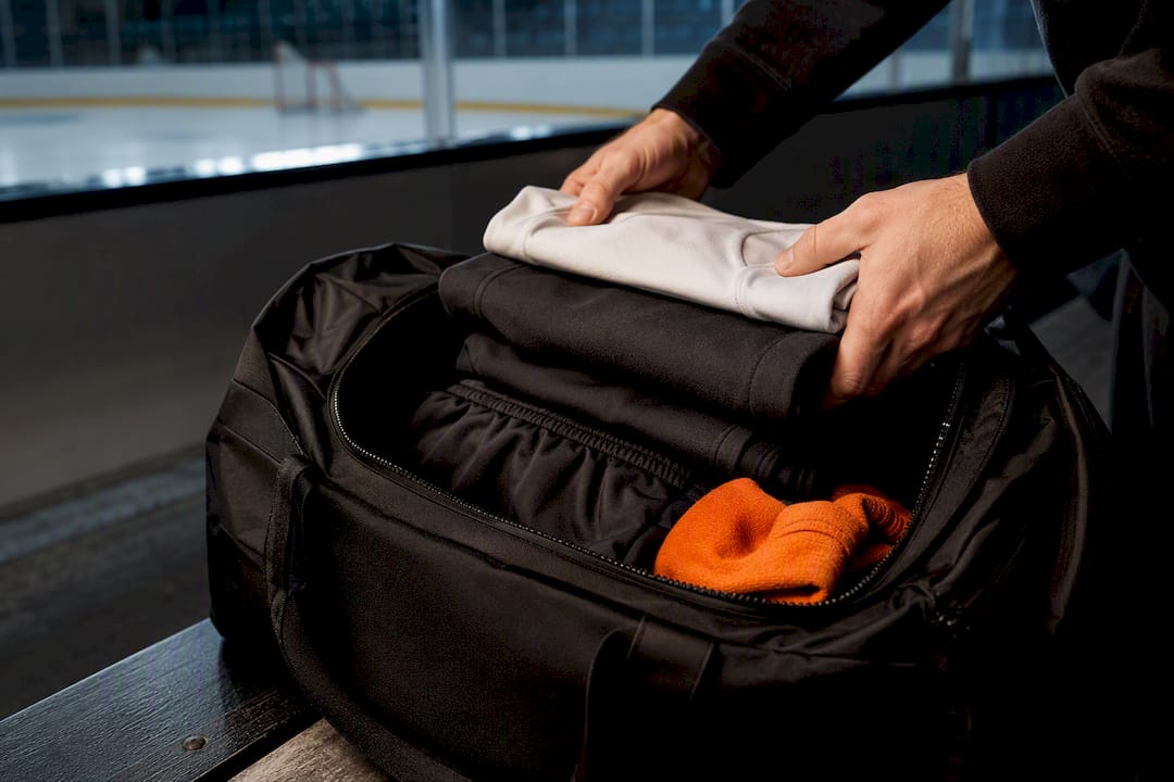 Anonymous hockey apparel packed beside rink