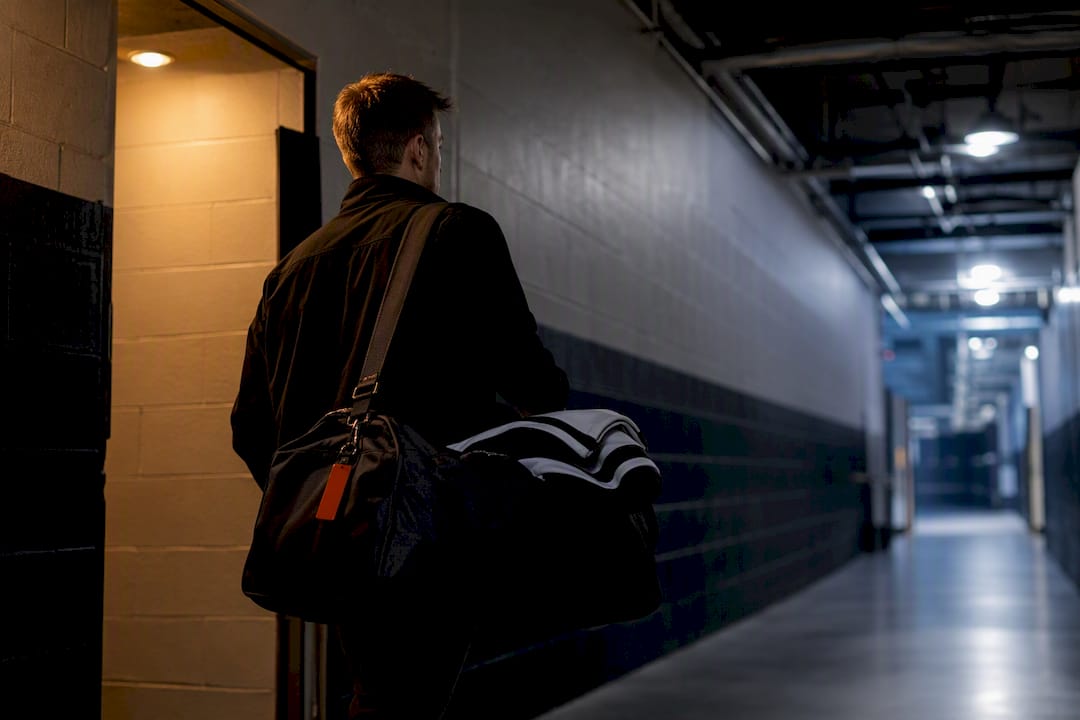 Manager carrying hockey tournament gear